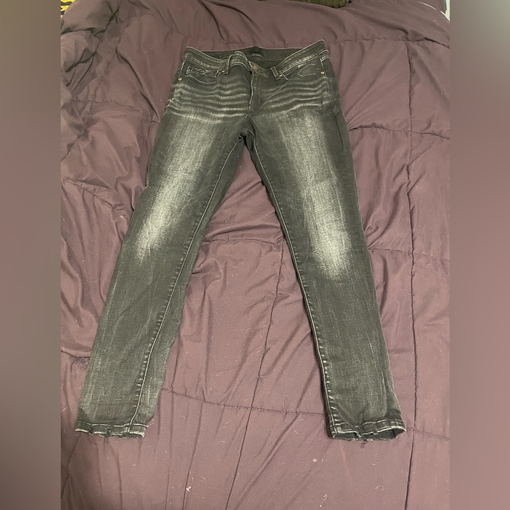Buckle black skinny jeans